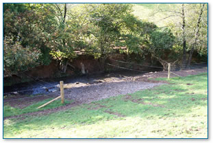 Fenced riverbank with drinking point